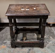Antique dark oak joint stool, the rectangular top with floral and leaf carving and thumbmoulded