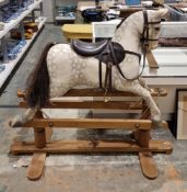 Early to mid 20th century dapple grey painted rocking horse on wooden base, believed to be made