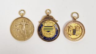 9ct gold relay race medallion, 9ct gold and enamel sporting medallion and 9ct gold sporting