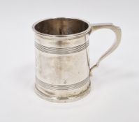 Silver mug by Walker & Hall, Sheffield 1921, of tapering circular form with engraved bands, scroll