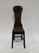 18th/early 19th century mahogany correction chair having shaped solid back and solid seat, on square