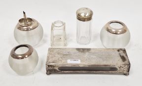 Silver matchbox cover, London 1907 of plain rectangular form, on four ball feet with facsimile