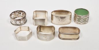 Seven various Late Victorian and Edwardian silver napkin rings, including engine turned and engraved