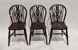 Set of four late 19th/early 20th century elm and ash wheelback dining chairs on turned baluster legs