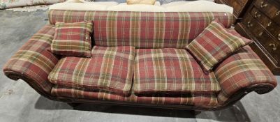 19th century rosewood scroll end sofa, upholstered in a red tartan fabric, the scrolling arms carved
