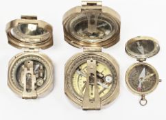 Two replica Stanley of London brass compasses, largest 8cm wide and another gilt metal cased compass