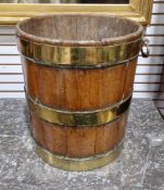 19th century mahogany and brass bound bucket or pail, of cylindrical tapering form and coopered
