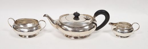 Silver three-piece bachelor's teaset by Harrods Limited 1936, comprising teapot, two-handled sugar