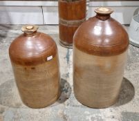 Two large 19th century two-tone brown stoneware flagons, the rims with impressed marks for Baull &