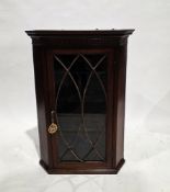 George III mahogany satinwood and ebony inlaid hanging corner cupboard, the single astragal-glazed
