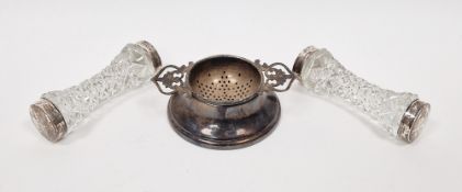 Pair silver-mounted cut glass knife rests, Birmingham 1903 and a silver tea strainer with pierced