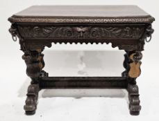 Victorian oak heavily carved small library table, the rectangular top with canted corners and carved