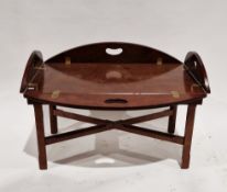 Mahogany butler's tray-style coffee table in the George III manner, the top with four folding flaps,