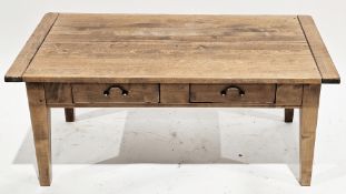 Modern hardwood coffee table, the rectangular top over two frieze drawers, on square tapering
