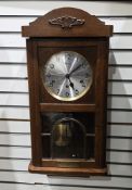 Mid-century Kieninger wall clock, the oak case with partial glazed door, the silvered dial with