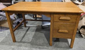 Mid century oak office desk, the rectangular top over a single pedestal with two drawers and long