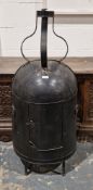 19th century metal meat hastener of domed form, the barrel back with door, 108cm high x 50cm wide