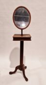 19th century mahogany shaving stand, the oval adjustable mirror above a square top with two hinged