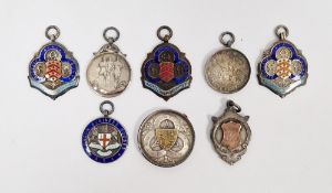 Seven silver and enamel sporting medallions, 104g total approx and another bronze-coloured metal