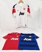 Manchester United 2010-11 home and away shirts, by Nike, sponsored by Aon, with Barclays Premier