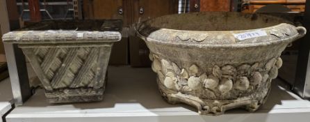 Pair of composite stone circular garden planters with relief decoration of fruits amongst foliage,