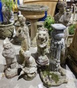Five reconstituted stone garden statues including a lion sejant, Venus de Milo and others and a