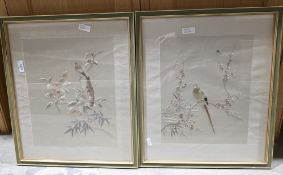 Pair of Oriental silk embroideries on fabric depicting birds within flowering branches, 44cm x 37cm,