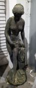 Cast garden figure of scantily clad female, one hand resting on a pillar, 119cm high  Condition