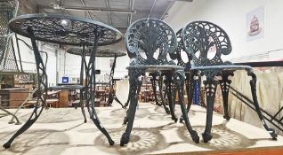 Ornate garden aluminium table and two chair set in the Victorian manner, with a green finish,