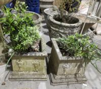 Pair of cuboid planters in reconstituted stone, the sides decorated with classical urns, 30cm