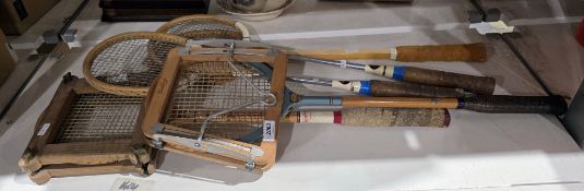 Five vintage badminton rackets including Lilywhites and Hayes, one with a Dunlop press and another