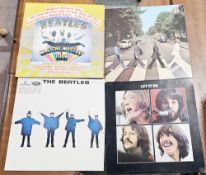 Collection of 12 Beatles vinyl LPs, later reissues including Let It Be, The White Album, Help, Abbey