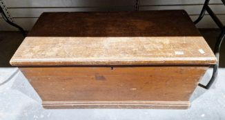 19th century stained pine blanket box with interior candle box, on a plinth base and iron handles,