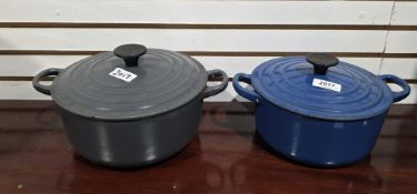 Two Le Creuset cast iron lidded cooking pots, one blue stamped B to base and the other grey