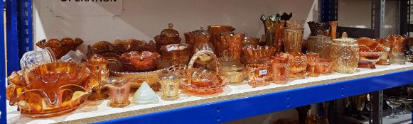 Large collection of carnival glass, amber, gold and petrol tinted, including: frilled bowls,  vases,