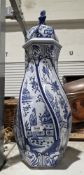 French George Martel Desvres blue and white delft-style lidded urn of wrythen form, 59cm high