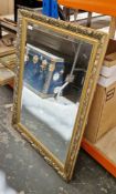 20th century giltwood rectangular wall mirror moulded with berried leaves, with bevelled glass, 87cm