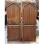 Pair of Victorian carved oak gothic-style doors with cast iron fittings, carved with linen fold,