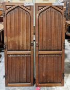 Pair of Victorian carved oak gothic-style doors with cast iron fittings, carved with linen fold,