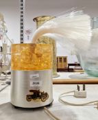 Table lamp with shatterline and stainless steel body, with fibre-optic plume to top