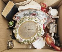 19th century oval ceramic clock decorated with flowers and cherub, possibly by Sitzendorf, the