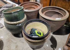 Nine various glazed terracotta garden planters in sizes from 50cm diameter to 31cm diameter, largest