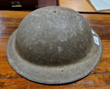 WWII 'Brodie' metal infantry helmet, the underside of rim stamped 'F&L 1000 1/1940'