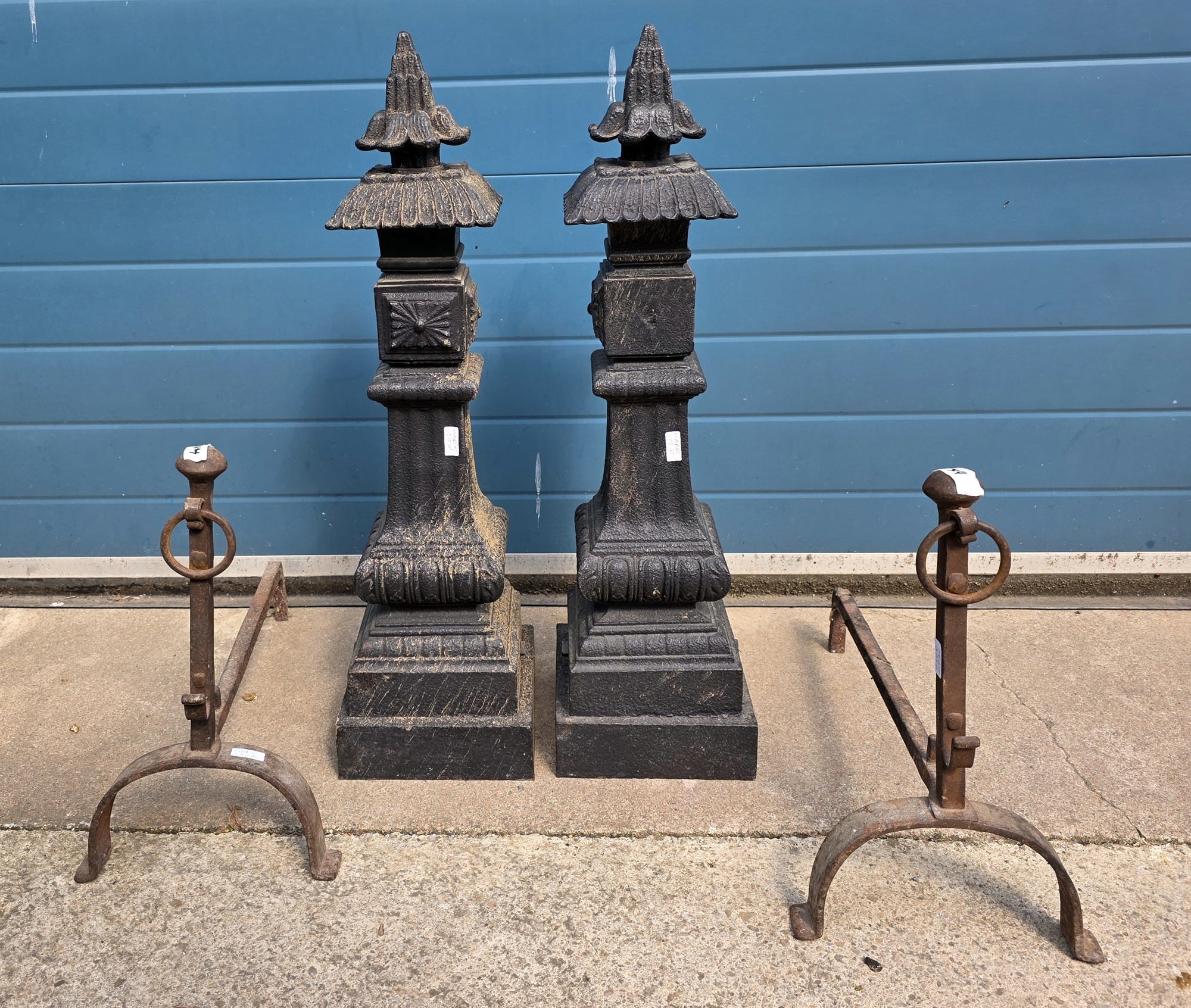 Pair of cast iron decorative garden pillars, of Asian design, with moulded decoration and pagoda