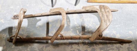 Vintage wooden camel saddle, metal-mounted, 127cm long