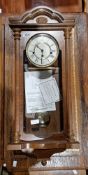 Wooden cased wall clock  Condition Report See photo for manufacturer name.