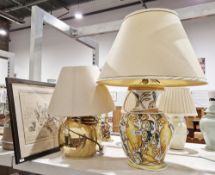 Two modern table lamps and a print after Louis Wain titled 'The Merry Coster' (3)