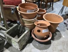 Quantity of mainly terracotta plant pots of varying shapes and sizes, including a herb planter