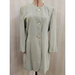 Laurel three-quarter length fitted coat with mother-of-pearl three button fastening, collarless,