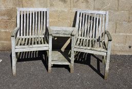 Hardwood tete-a-tete garden bench, two seats separated by integral table with undertier by